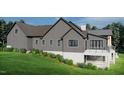 Another side view highlighting the home's architectural details and landscaping at 143 High Ridge Ln, Pittsboro, NC 27312