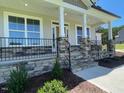Inviting entryway with stone accents, leading to a welcoming residence at 23 Quail Pt Cir, Clayton, NC 27520