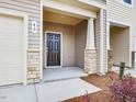 Front entry with stone accents and black door at 40 Lavender Ln, Clayton, NC 27520
