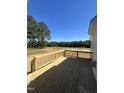A spacious wooden deck overlooks a large green lawn at 52 Quail Point Cir, Clayton, NC 27520