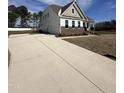 Charming two-story home with a long driveway and a spacious front yard at 52 Quail Point Cir, Clayton, NC 27520