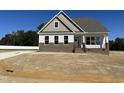 Two-story home with brick accents and a spacious front yard at 52 Quail Point Cir, Clayton, NC 27520