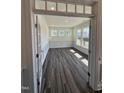 Bright office space featuring hardwood floors, wainscoting, and multiple windows for natural light and scenic views at 52 Quail Point Cir, Clayton, NC 27520