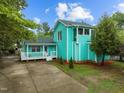 Charming two-story home with a well-maintained front yard, white picket fence, and inviting curb appeal at 802 N Franklin St, Wake Forest, NC 27587