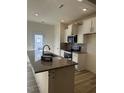 Modern kitchen featuring granite countertops and white cabinets at 16 Clementine Street St # 208, Angier, NC 27501