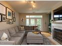 Comfortable living room offering a large sectional sofa, natural light, and a decorative fireplace at 1001 Hillsborough St # 304, Raleigh, NC 27603