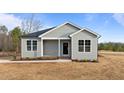 Charming single-story house with gray siding and a covered front porch at 190 Brookhaven Dr # 16, Spring Hope, NC 27882