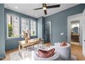 Comfortable home office with blue walls, natural light, and modern furnishings at 3723 Bellevue Rd, Raleigh, NC 27609