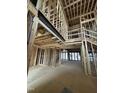 The skeleton of the home's living room featuring a steel beam running across an opening at 504 Colvard Woods Way Way, Durham, NC 27713