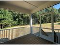 View from screened in patio showcasing beautiful wooded backyard at 236 Alden Way, Angier, NC 27501