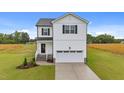 Two-story home showcasing a white exterior, black shutters, and a neatly manicured lawn on a sunny day at 35 Diamond Creek Dr, Zebulon, NC 27597