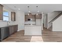 Modern kitchen features granite countertops, stainless steel appliances, and a spacious island perfect for entertaining at 35 Diamond Creek Dr, Zebulon, NC 27597