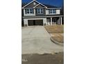 Two-story house with gray siding, dark trim, and a two-car garage at 333 Hopewell Branch Ct, Smithfield, NC 27577