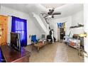 Living room with carpet, fireplace, and stairs at 1712 Gunter St, Durham, NC 27707