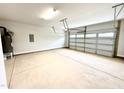 Spacious two-car garage featuring ample storage and a clean, well-lit environment at 320 Bishop Ln, Sanford, NC 27330