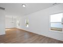 Bright dining room with hardwood floors and large windows at 3939 Willow Gate Way, Knightdale, NC 27604