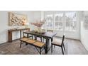 Bright dining room features a large window, modern table, and stylish decor at 2007 Opulent Oaks Ln # 24, Durham, NC 27713