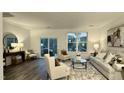 Spacious living room with comfy seating, a coffee table, and access to a deck at 2007 Opulent Oaks Ln # 24, Durham, NC 27713