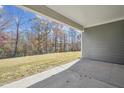 View of the lush green backyard from the covered back patio, perfect for outdoor living and relaxation at 2209 Abbeyhill Dr # 118, Raleigh, NC 27610