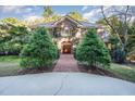 Two-story brick home with a walkway and landscaping at 107 Silo Dr, Chapel Hill, NC 27514