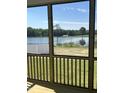 Screened-in porch overlooks beautiful waterfront property at 225 Bering Cir, Angier, NC 27501