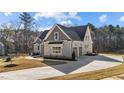 An elegant home with a spacious driveway and a well-maintained lawn at 25 Firefly Ln, Youngsville, NC 27596