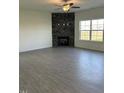 Bright living room with hardwood floors and a decorative fireplace with a stone backsplash at 238 Plains Dr # 313, Burlington, NC 27217