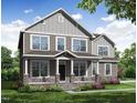 Charming two-story home with stone accents, a covered porch, and a beautifully landscaped front yard at 111 Demascus Way # 021, Four Oaks, NC 27524