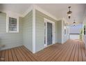 Spacious front porch features a wood deck and a light blue ceiling at 2024 Stanchion St, Haw River, NC 27258