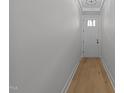 Bright entryway features light walls, wood floors, trimmed doorway, and a classic white front door at 811 Maple Berry Ln # 102, Raleigh, NC 27607