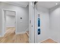 Hallway view with an elevator featuring call buttons and safety signage at 811 Maple Berry Ln # 104, Raleigh, NC 27607
