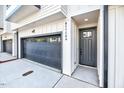 Exterior view showcasing the garage and front door of the modern townhome at 811 Maple Berry Ln # 104, Raleigh, NC 27607