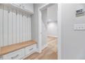 Mudroom featuring a bench with drawers and overhead cabinets for storage at 811 Maple Berry Ln # 104, Raleigh, NC 27607