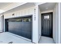 The home's exterior has an attached garage and a dark front door with the house number beside it at 811 Maple Berry Ln # 105, Raleigh, NC 27607