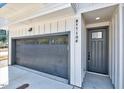 View of attached two-car garage and front door with house number at 811 Maple Berry Ln # 106, Raleigh, NC 27607