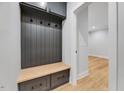 Convenient mudroom area with custom storage, bench seating, and hooks at 811 Maple Berry Ln # 106, Raleigh, NC 27607