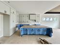 Bright kitchen with white cabinetry, modern hardware, and center island at 280 Forest Bridge Rd, Franklinton, NC 27525