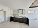 Spacious kitchen featuring modern cabinets, a central island, and a well-lit area at 280 Forest Bridge Rd, Franklinton, NC 27525