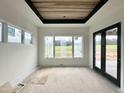 Sun-filled room with wooden inset ceiling and access to the outdoors at 280 Forest Bridge Rd, Franklinton, NC 27525