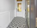 Welcoming entryway with decorative tile flooring and a glass-paneled front door that allows natural light at 33 Macy Cir, Wendell, NC 27591