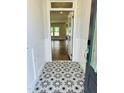 Elegant foyer featuring decorative tile flooring and views into the adjacent living spaces at 33 Macy Cir, Wendell, NC 27591