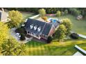 Expansive brick home featuring mature trees, a pool, and a large, well-manicured lawn at 166 Weldon Dr, Clayton, NC 27520