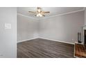 Living room with hardwood floors and ceiling fan at 501 Kendall Dr, Durham, NC 27703