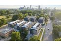 Aerial view of new construction modern townhomes with a scenic city skyline in the background at 10 Seawell Ave # 102, Raleigh, NC 27601