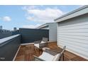 Relaxing rooftop deck featuring wooden flooring and comfortable seating with skyline views at 10 Seawell Ave # 102, Raleigh, NC 27601