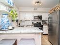 Well-equipped kitchen with stainless steel appliances, granite countertops, and a functional layout at 3736 Jamestown Cir, Raleigh, NC 27609