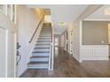 Open foyer with hardwood floors and staircase leading to the upper level at 98 Valley Brook Ln, Spring Lake, NC 28390