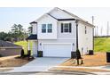 Beautiful two-story home with a 2-car garage, neutral siding, and well-maintained landscaping at 305 Little Creek Dr, Lillington, NC 27546