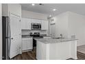Island kitchen features granite countertops and stainless steel appliances at 434 Glover Pk Mem Dr, Nashville, NC 27856