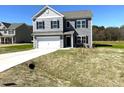Front view of a two story home with gray siding, white trim and black shutters at 158 Citizens Ct # 32, Four Oaks, NC 27524